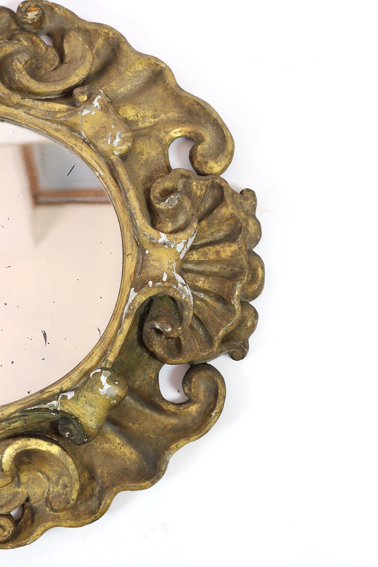 An 18th century Baroque giltwood wall mirror, width 95cm, height 84cm